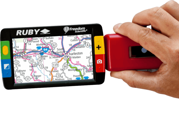 Image of Ruby magnifier in hand looking at a map