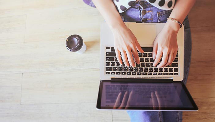 Woman typing on laptop