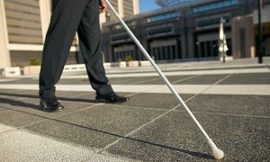 Blind person using white cane