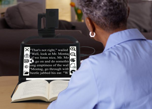Woman reading a book using the ONYX PRO