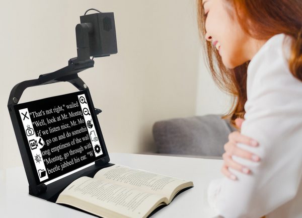 Woman reading a book using the ONYX PRO