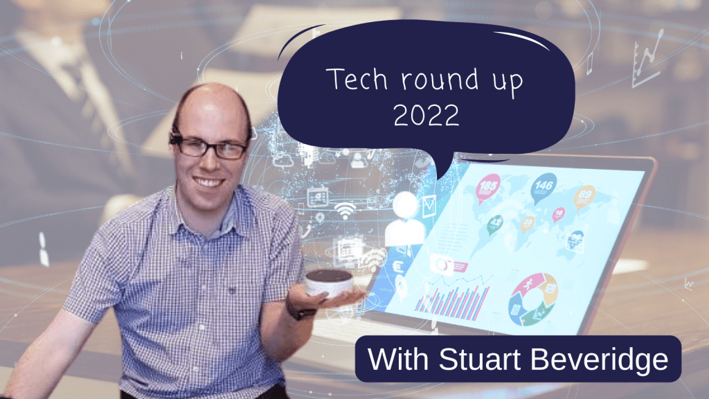Busy background image with a laptop and lots of icons on the screen. In the foreground is a photo of Stuart Beveridge holding an amzon echo dot. Speech bubble reads: Tech round up 2022. Text at the bottom of the graphic: with Stuart Beveridge.