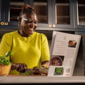 Lady reading cooking book