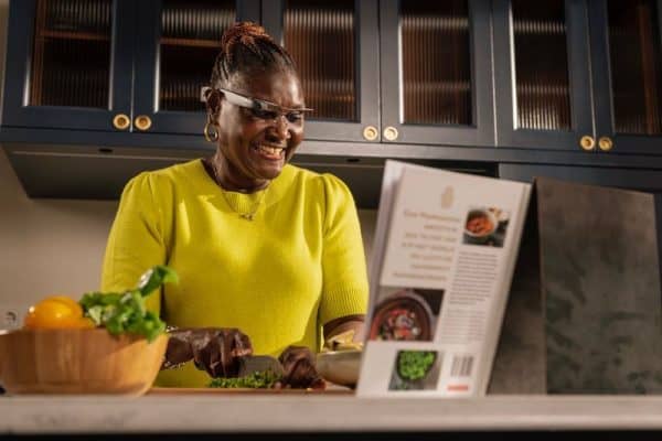 Lady reading cooking book