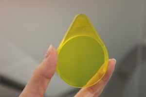 Image of two fingers holding fluorescein filter