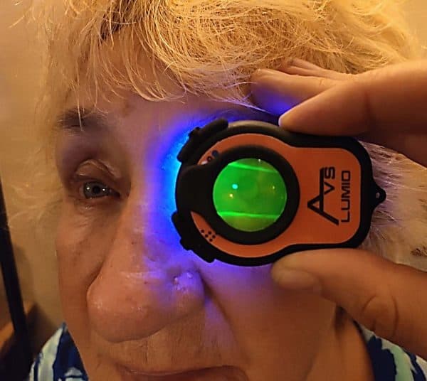 Photo of Lumio held in front of lady's eye